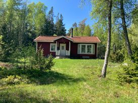 Cottage on a forest plot by the sea