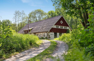 Lakeside 19th-century house in a forest setting