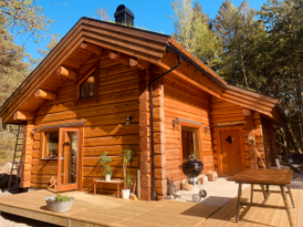 Modern log house in beautiful nature